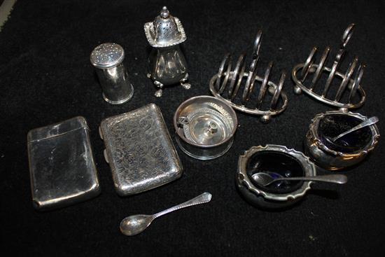 Pair silver toastracks,  5 silver condiments, 2 cigarette cases, spoon, small taper stick
